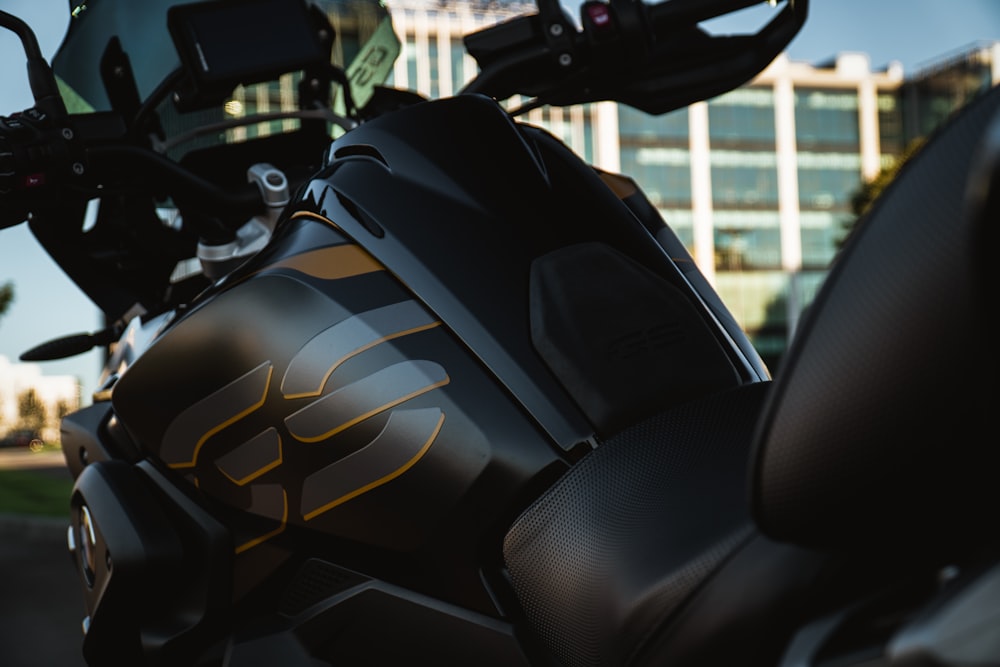 a close up of a motorcycle with a building in the background