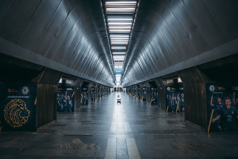 a person riding a bike down a long hallway