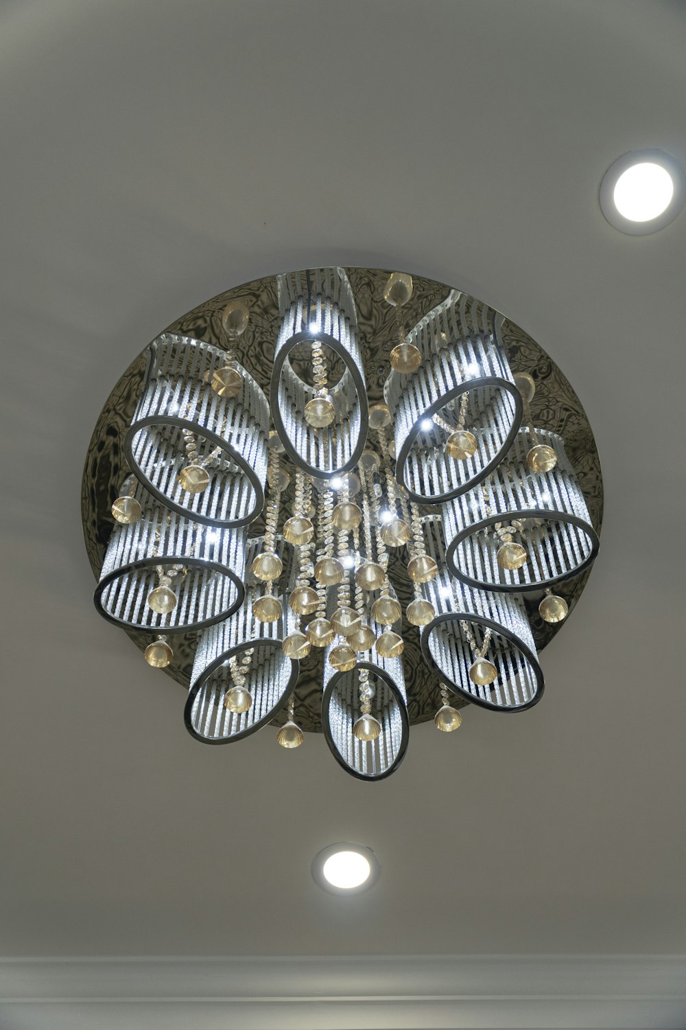 a circular light fixture hanging from the ceiling
