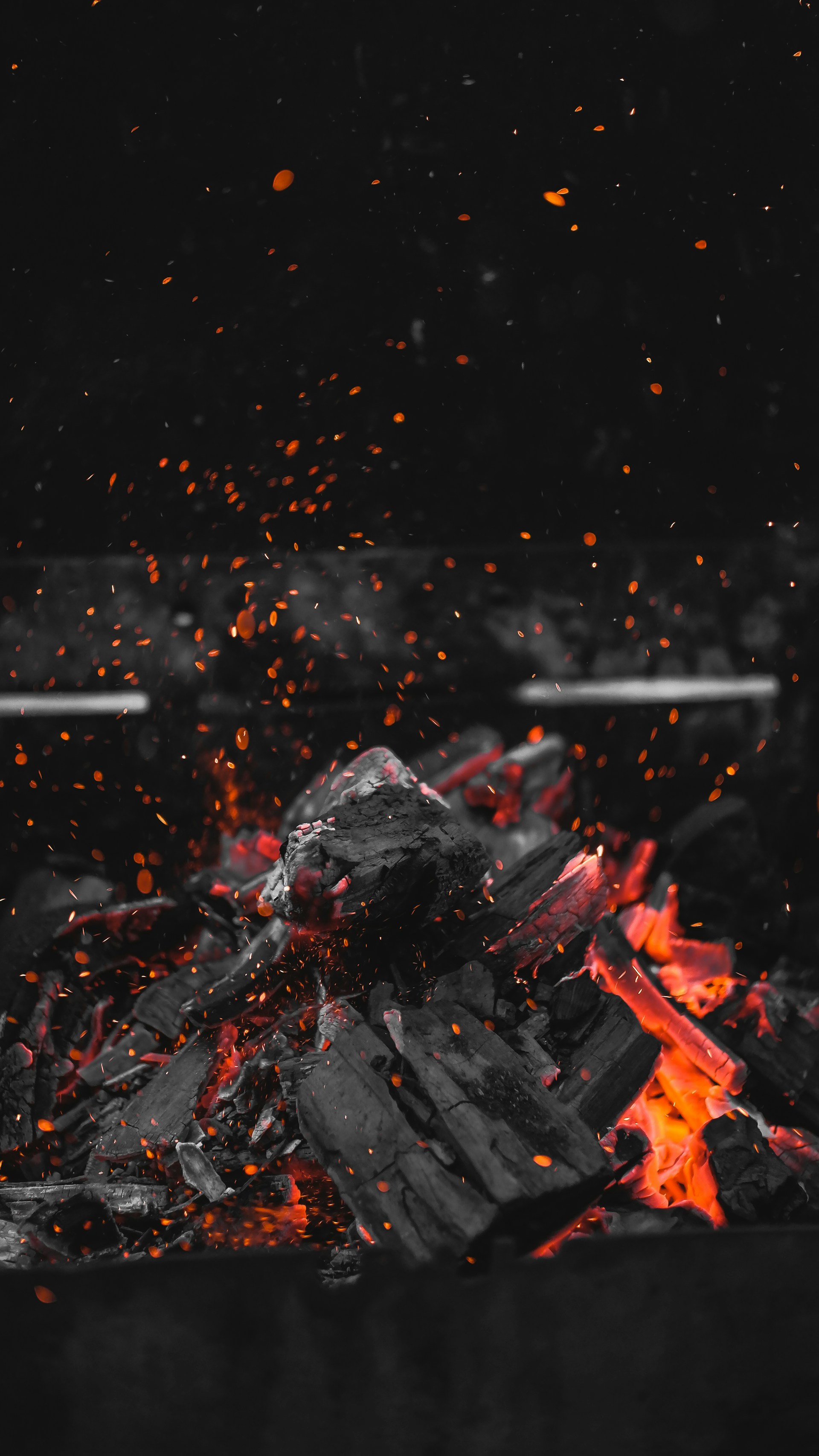 a black and red photo of a pile of coal
