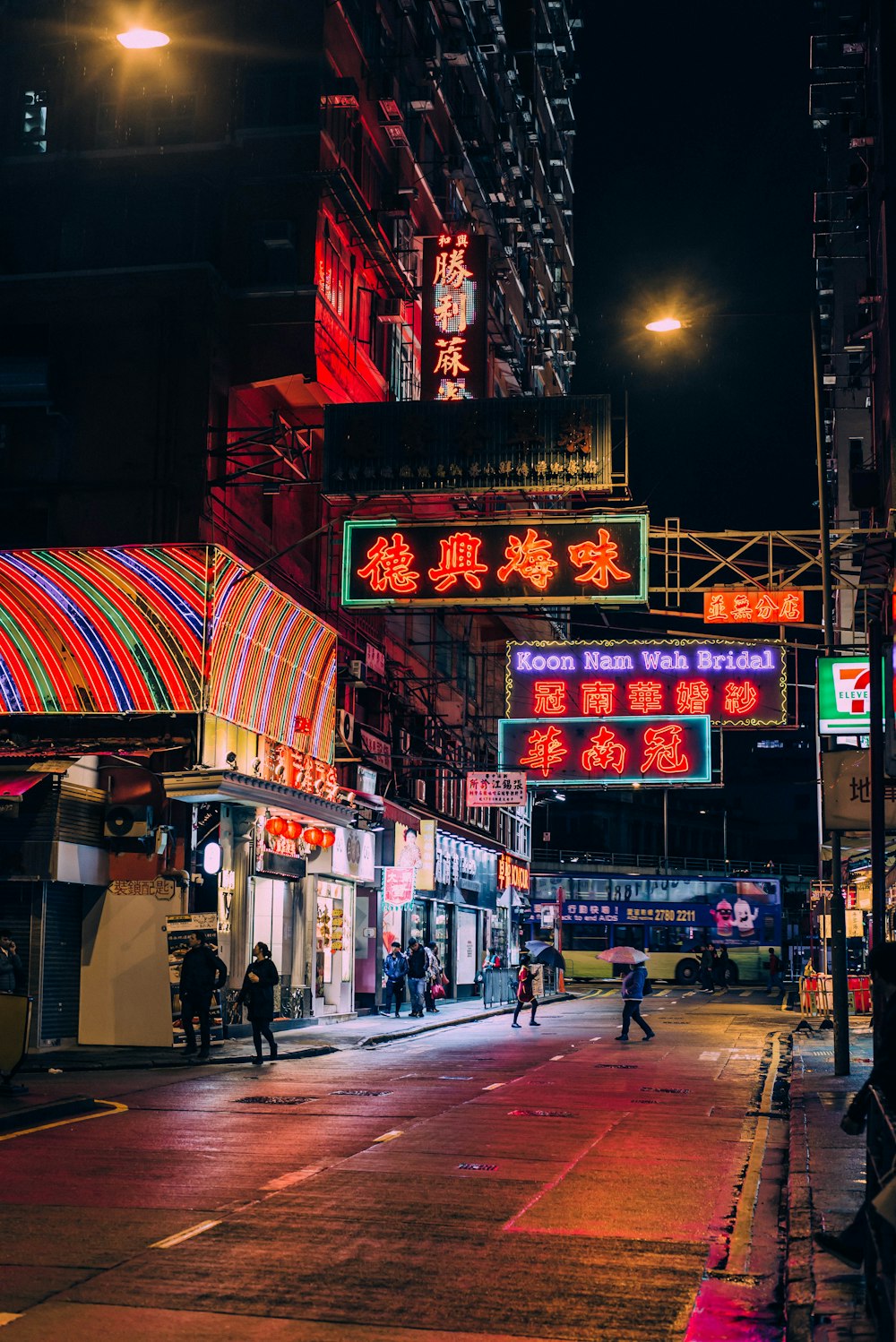 a city street filled with lots of neon signs