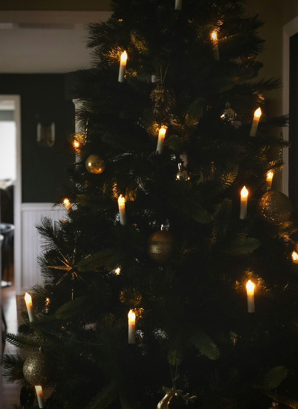 a lit christmas tree in a living room