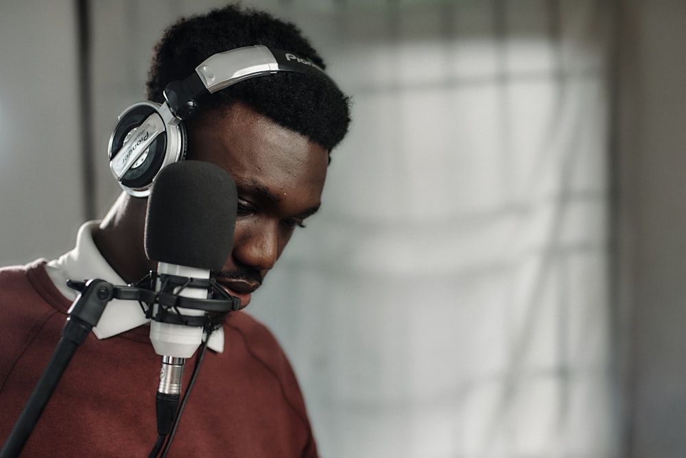 a man wearing headphones and a microphone