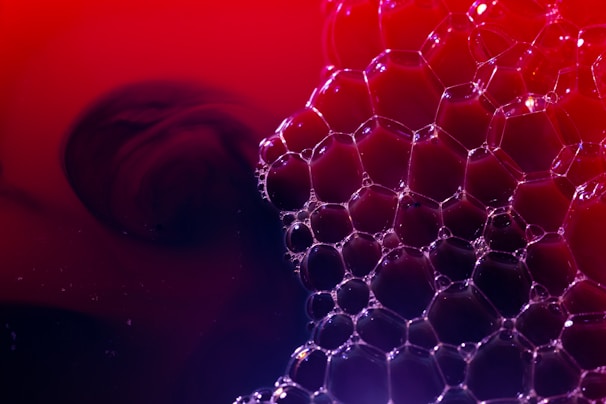 a red and blue background with bubbles