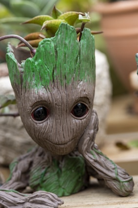 A warm, friendly digital character symbolizing a small seed growing into a vibrant tree of ideas.