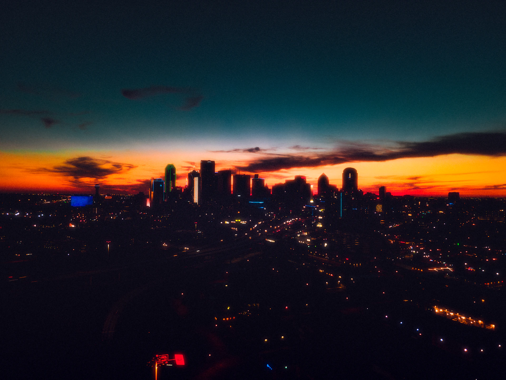 a view of a city at night from the top of a building