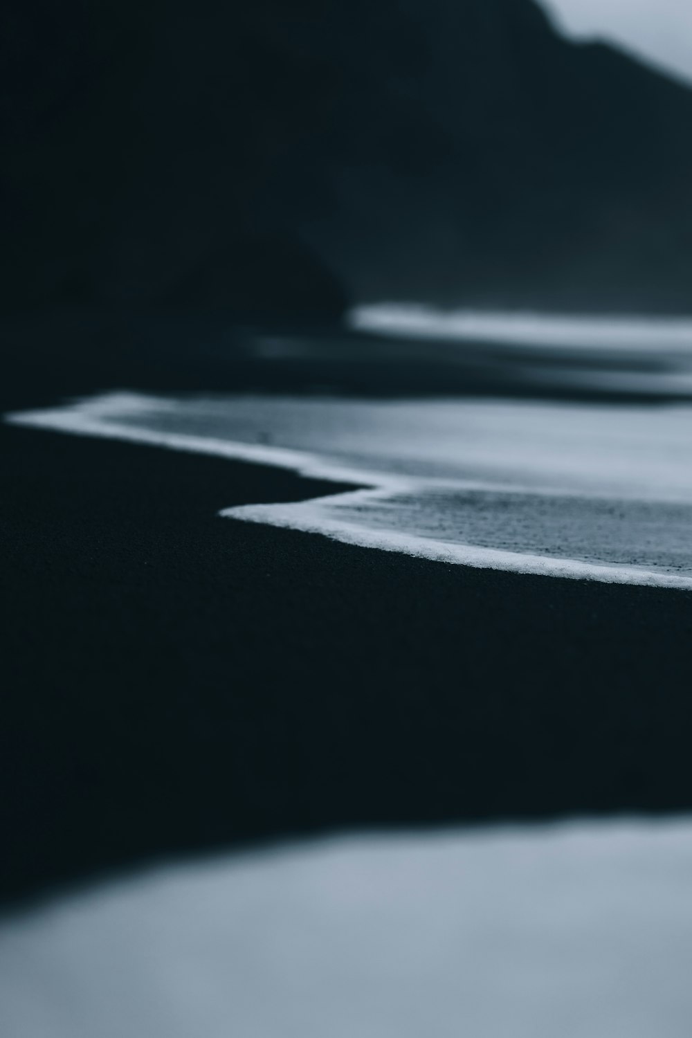 a black and white photo of a beach