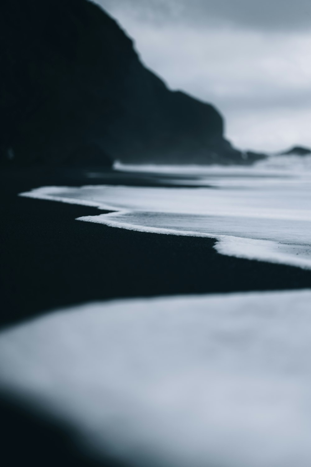 a black and white photo of a beach