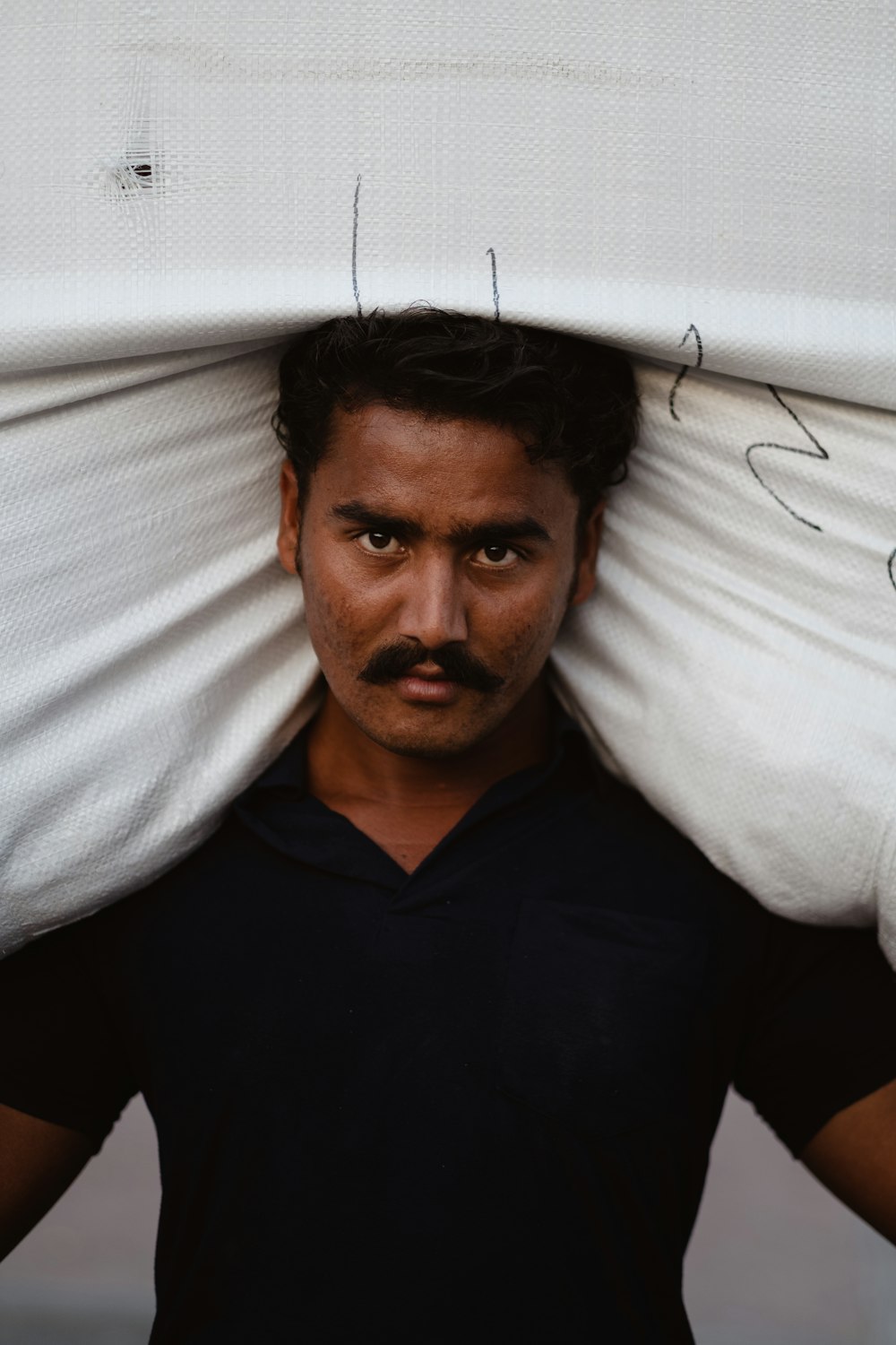 a man holding a surfboard over his head