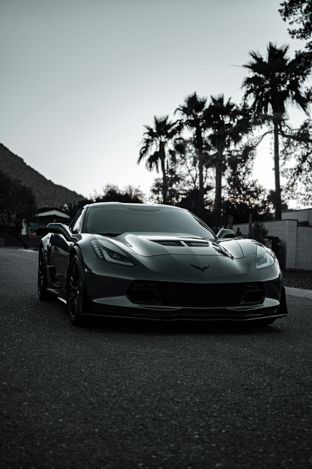 a black and white photo of a sports car
