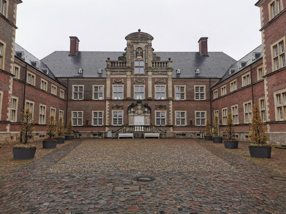 a large brick building with a clock tower