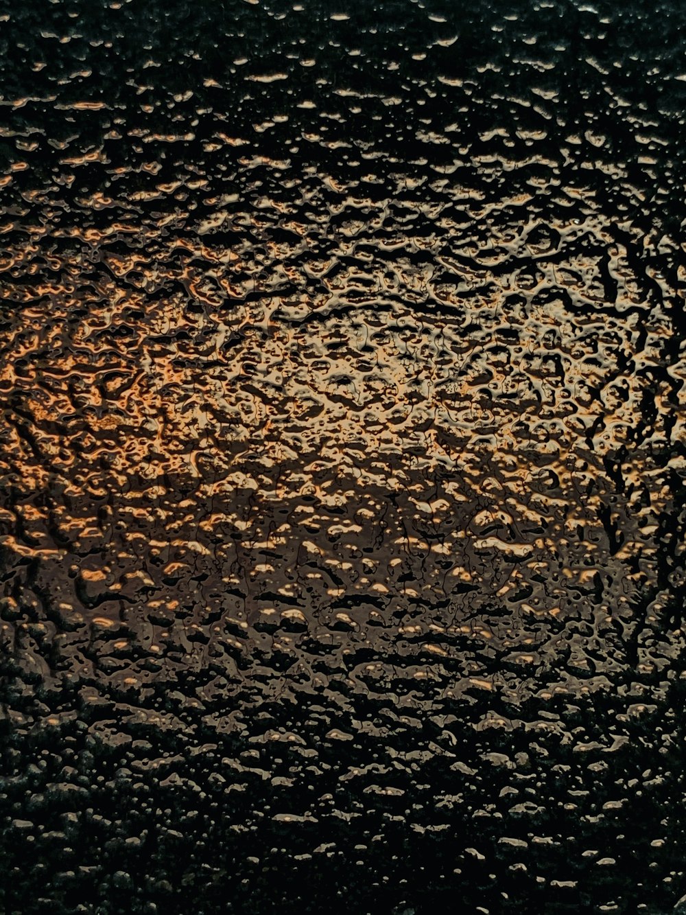 a close up of a window with drops of water on it