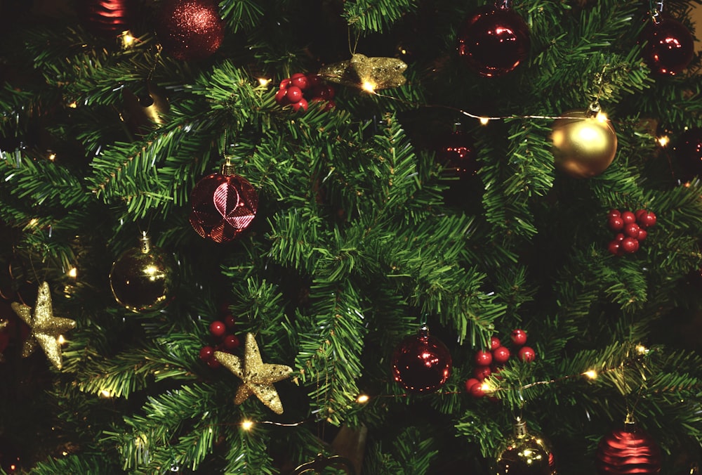 a close up of a christmas tree with ornaments