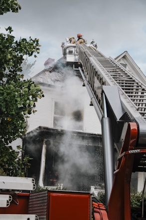 a firetruck with smoke coming out of the back of it
