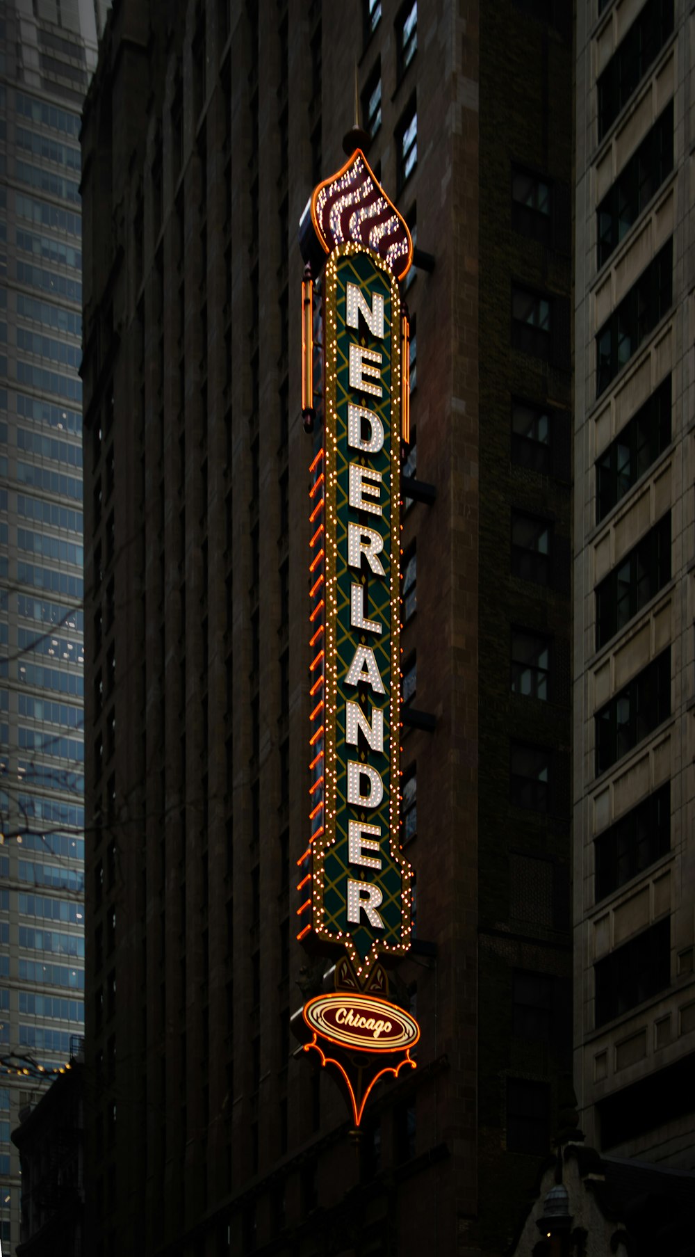 a large neon sign on the side of a building