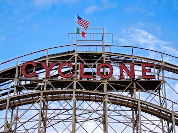 a sign that says cyclone on top of a building