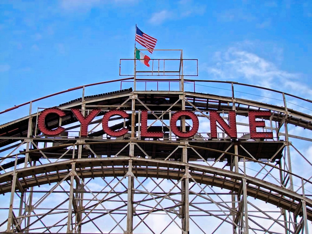 a sign that says cyclone on top of a building