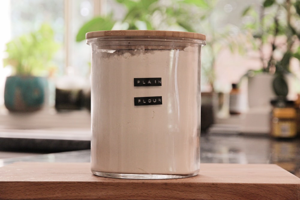 a jar with a label on it sitting on a counter