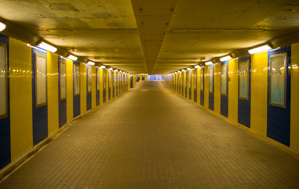 a long hallway with yellow and blue walls