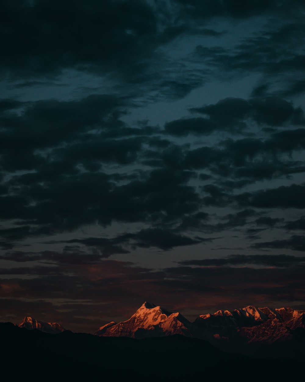 a view of a mountain range at night