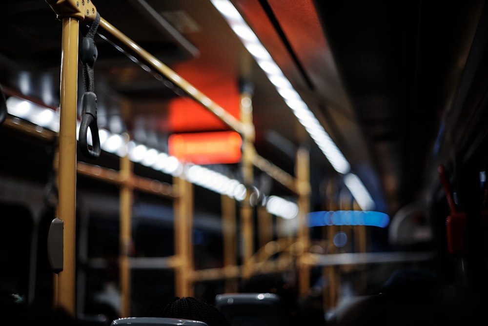 the interior of a public transit bus at night