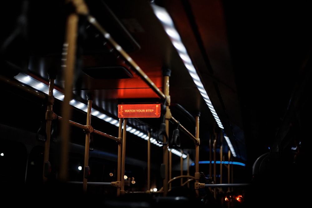 a red sign that is on the side of a rail