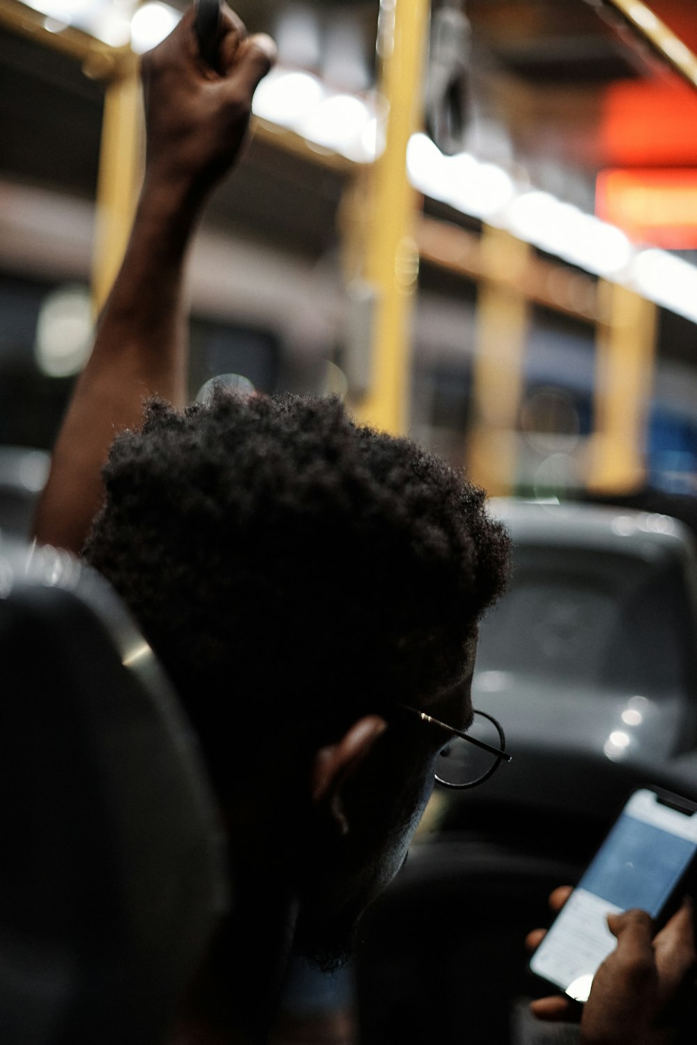 a man holding a cell phone up to his ear