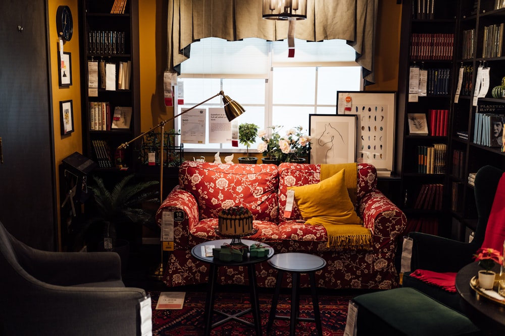 a living room filled with furniture and a window