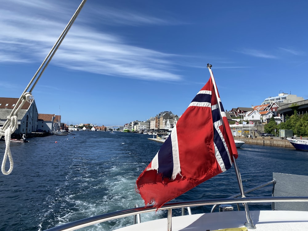 a flag on the back of a boat in the water