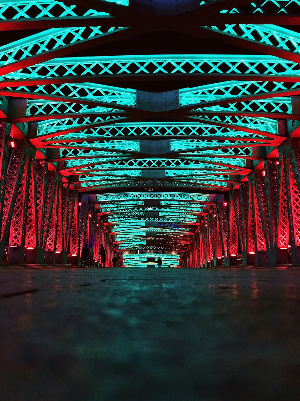 a long walkway with red and blue lights