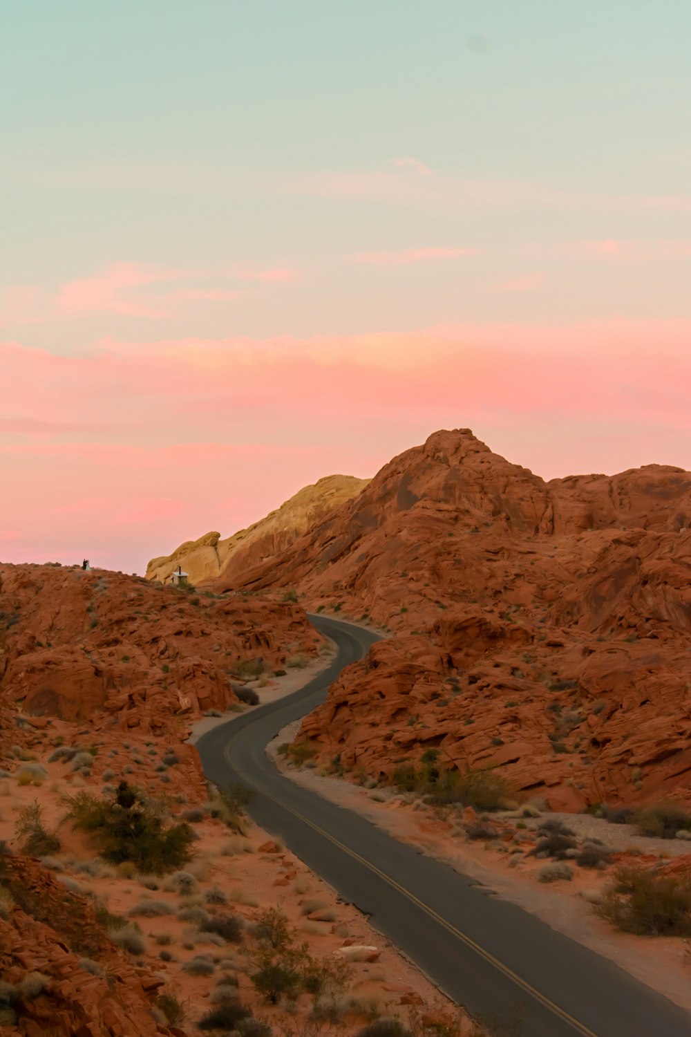 a winding road in the middle of a desert