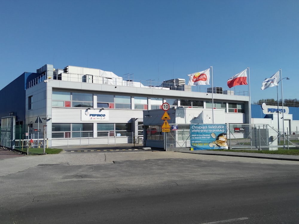 a large building with flags on top of it