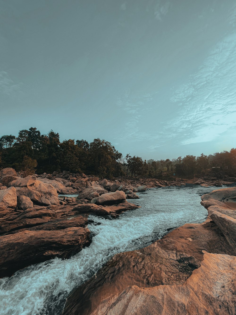 a river flowing between two large rocks