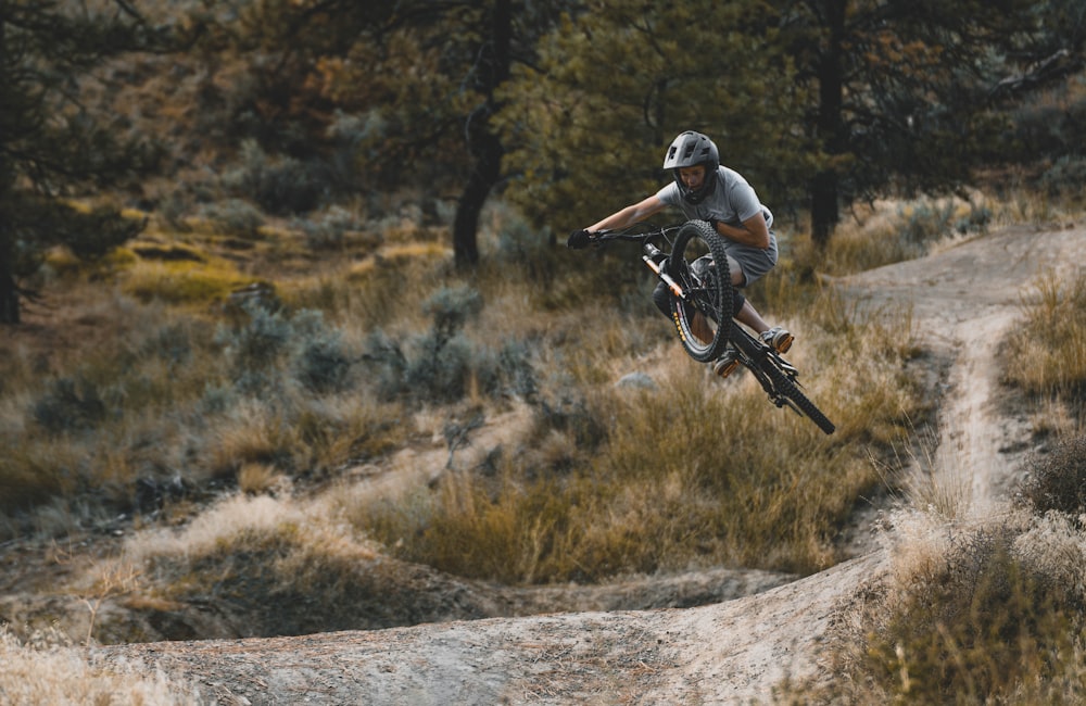 a person jumping a bike in the air