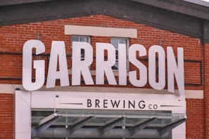 a brick building with a sign that says garrison brewing