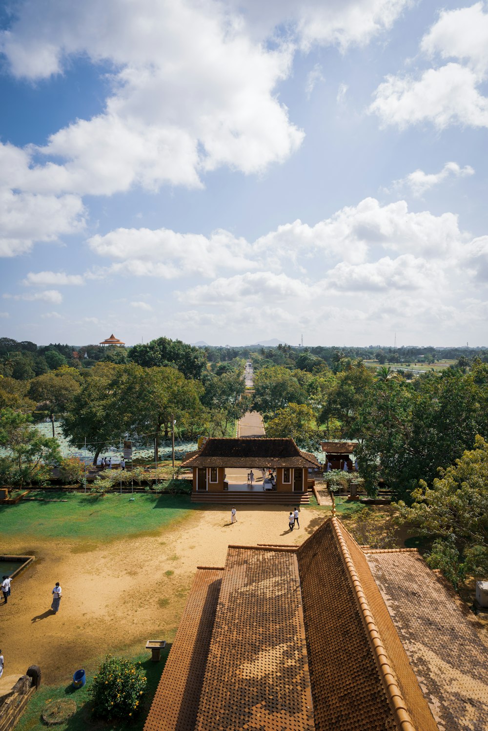 an aerial view of a building with people walking around