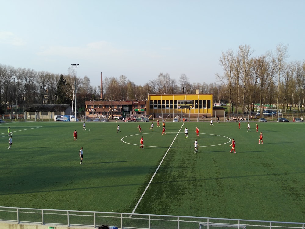 a group of people playing soccer on a field