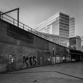 Before and after shots of a renovated urban building showcasing transformation.