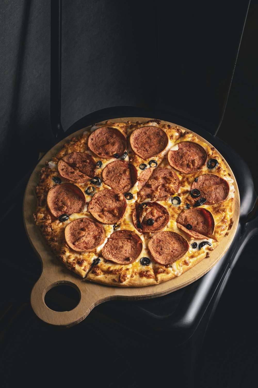 a pizza sitting on top of a pan on top of a table