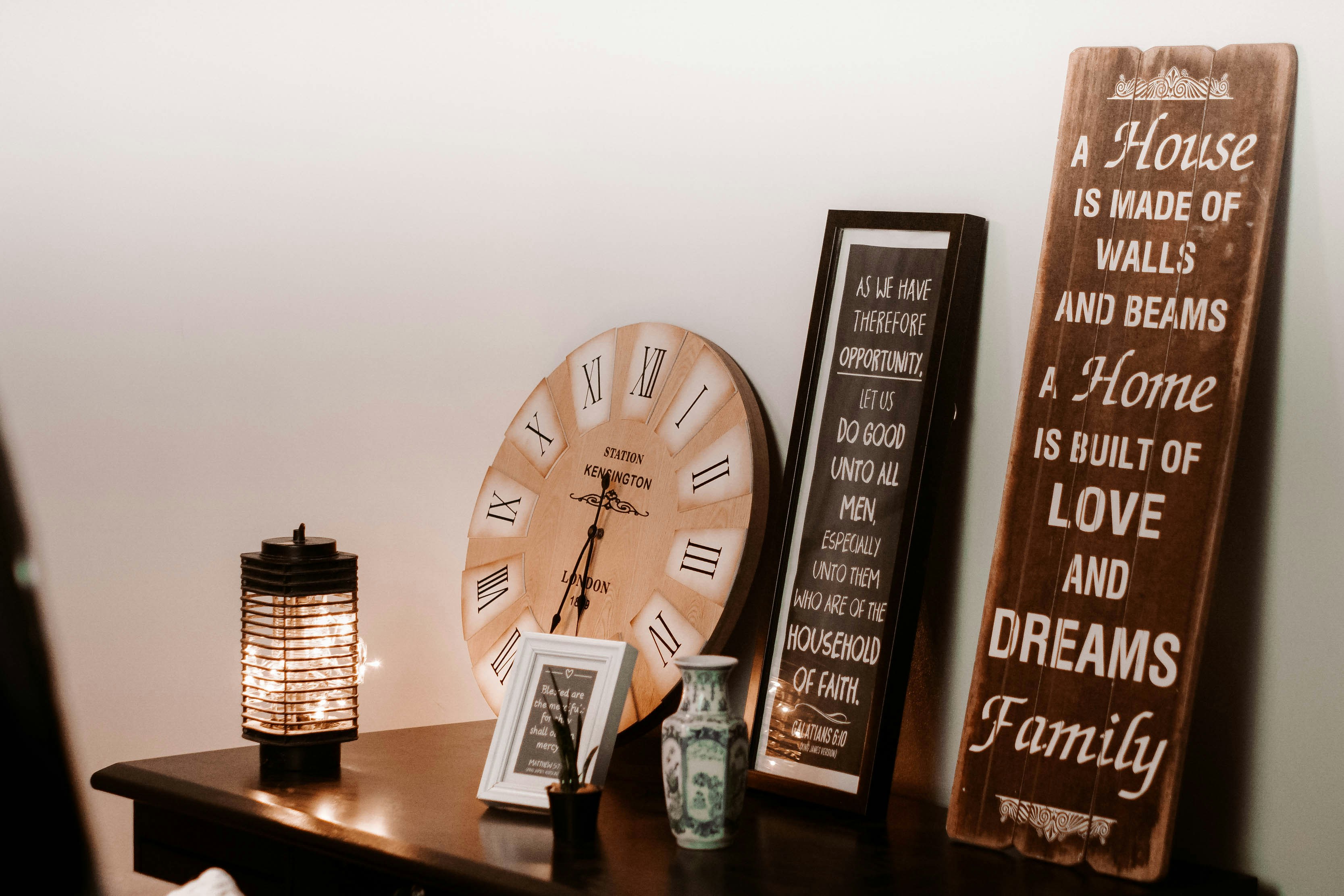 a table with a clock and a couple of signs