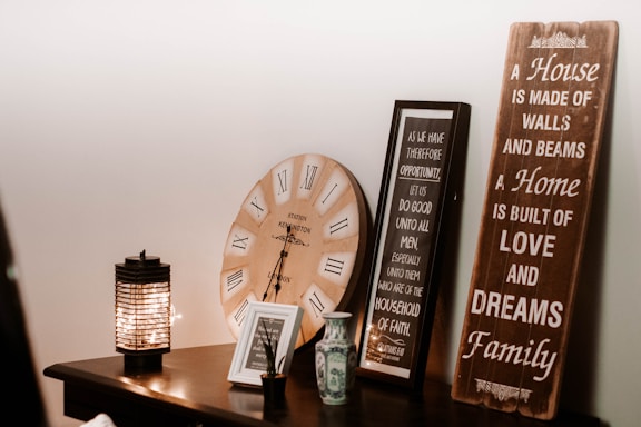 a table with a clock and a couple of signs