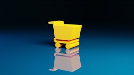 A small, bright yellow shopping cart sits on a reflective blue surface, creating a mirror effect. The background is a gradient from deep black at the top to a lighter blue at the bottom.