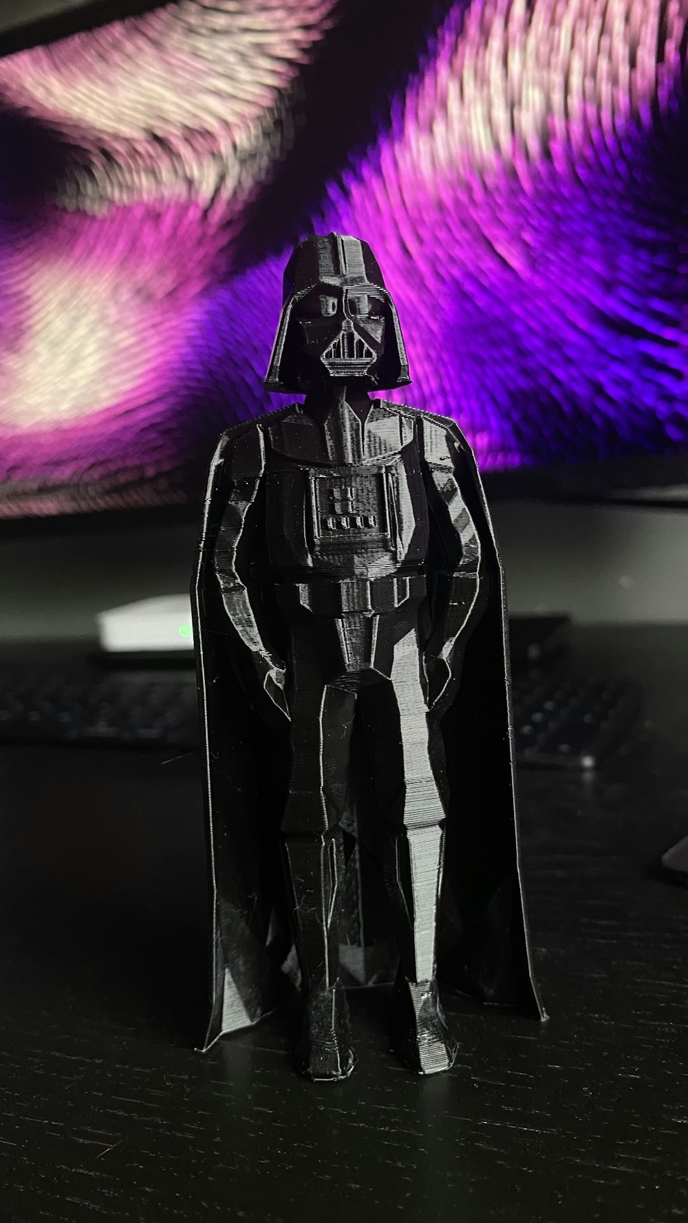 a paper model of darth vader standing in front of a computer