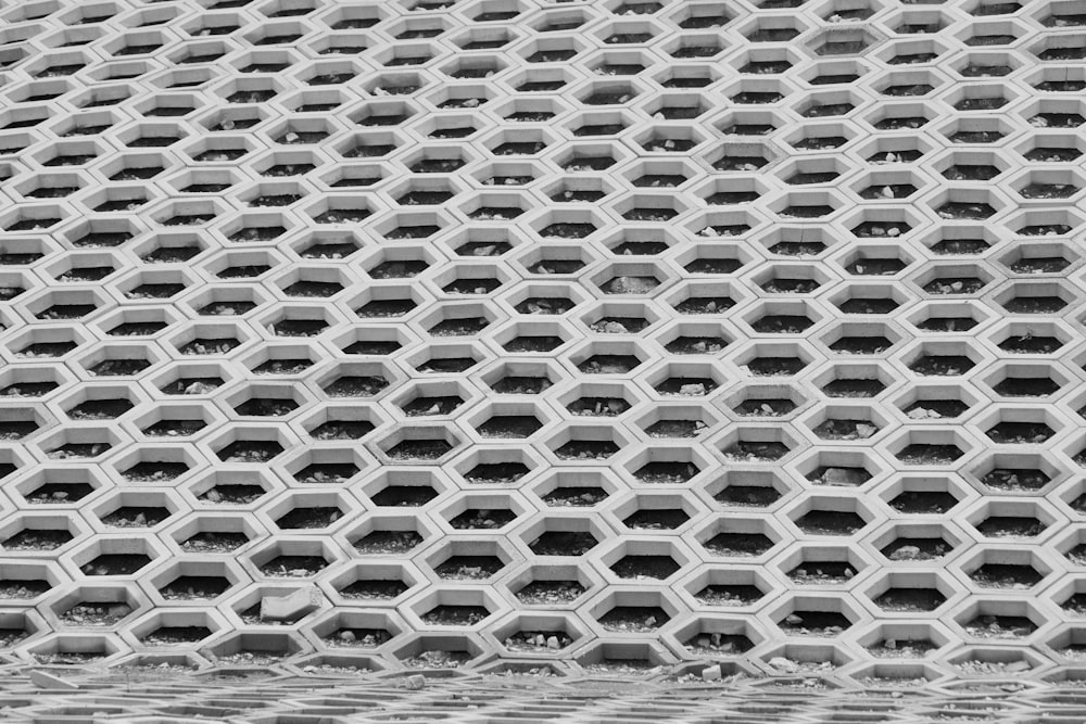 a black and white photo of a metal grate