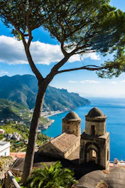 a scenic view of the ocean and mountains