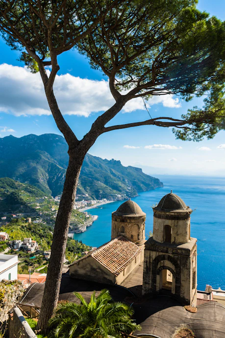 a scenic view of the ocean and mountains