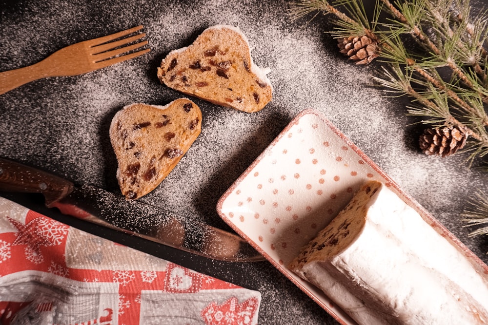 a couple of heart shaped cookies sitting on top of a table