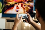 a man playing a video game on the nintendo wii