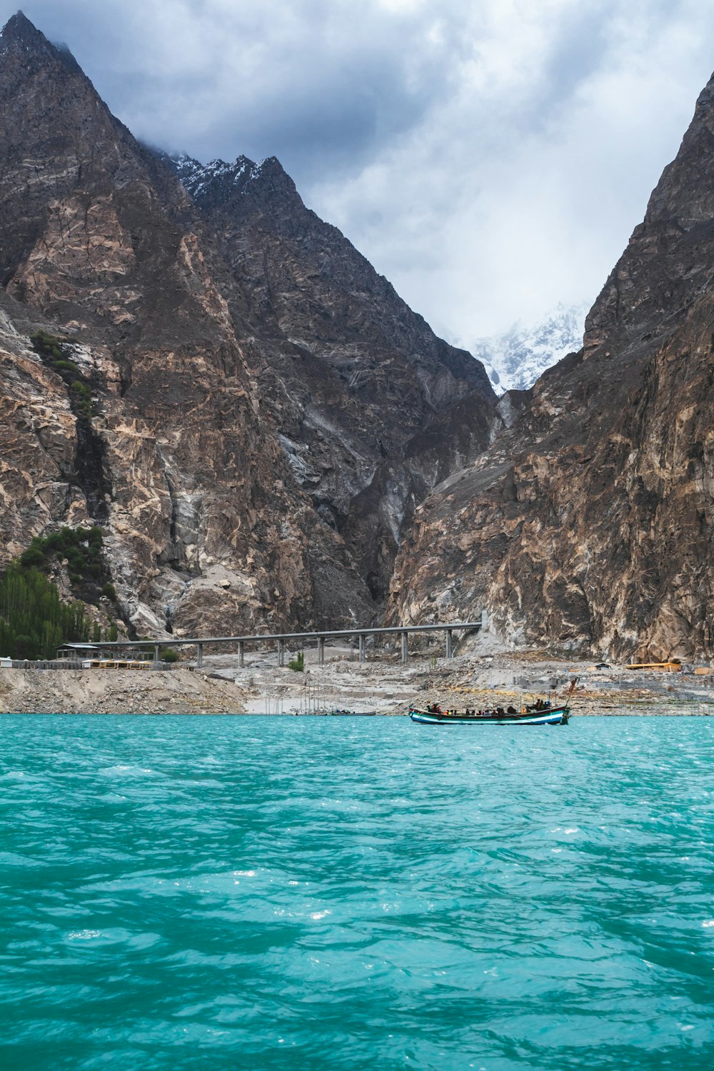 a body of water with mountains in the background