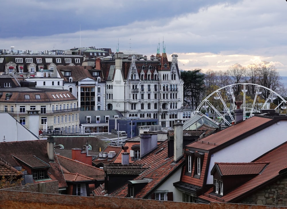 a view of a city with a ferris wheel in the distance